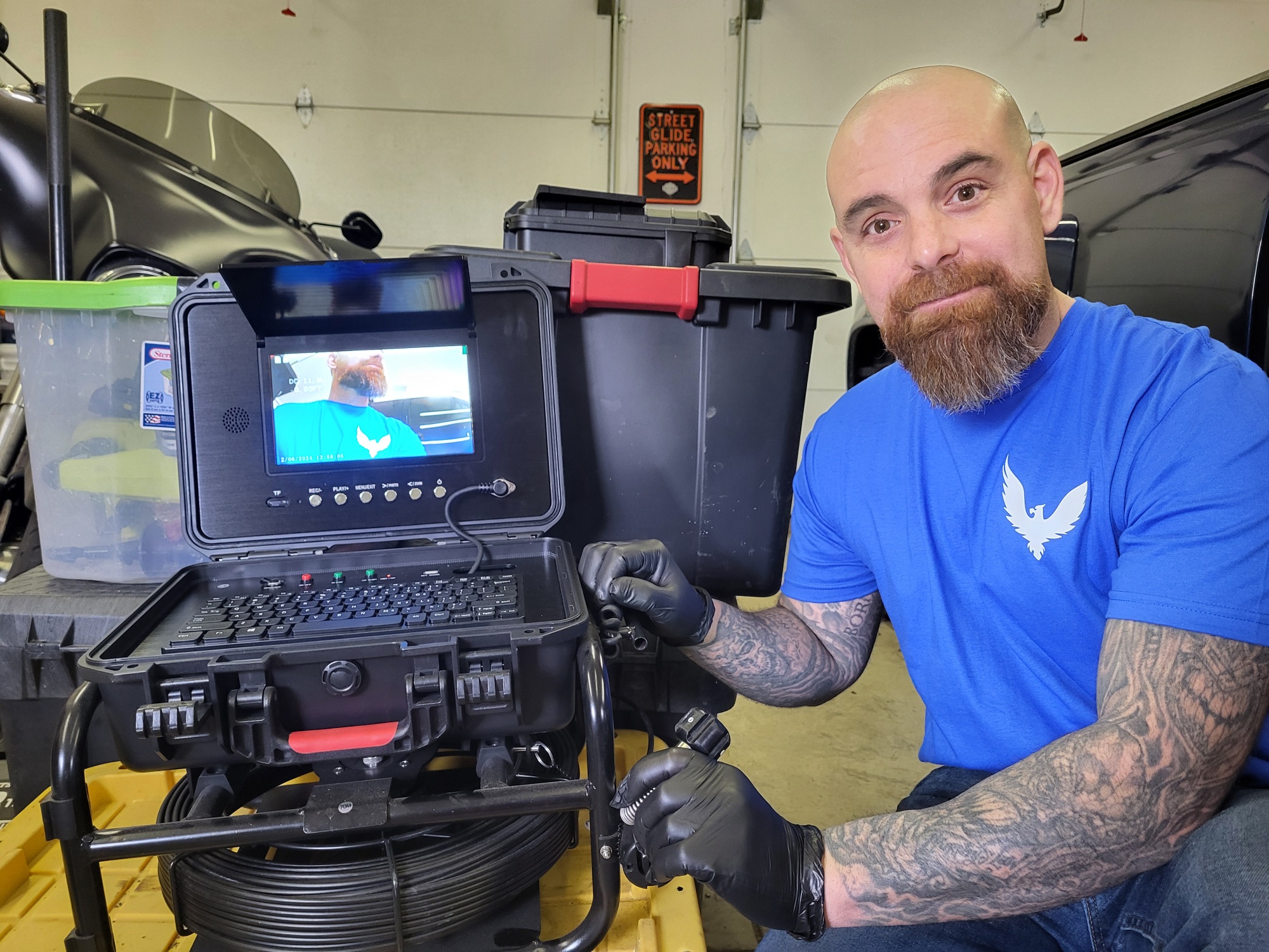 Drew with sewer scope video camera inspection equipment